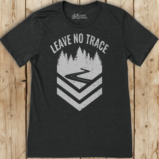 Black t-shirt with 'Leave No Trace' graphic on a wooden background