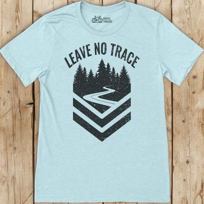 Light blue t-shirt with 'Leave No Trace' graphic on a wooden surface