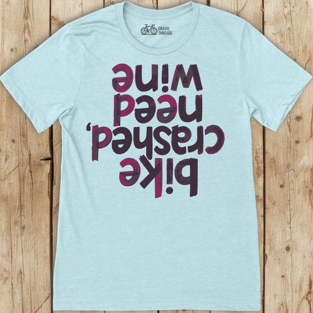 Funny light blue cycling shirt that reads "bike crashed, need wine"