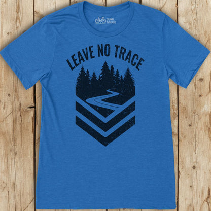 Blue t-shirt with 'Leave No Trace' graphic on a wooden surface